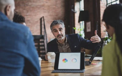 ey-businessman-leading-a-business-meeting-with-presentation ey-businessman-leading-a-business-meeting-with-presentation